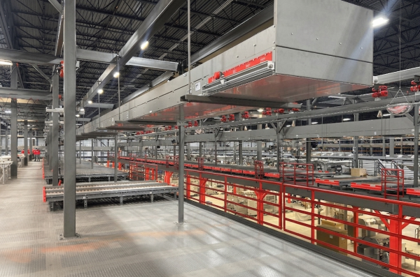 An industrial-style warehouse room with various different red and silver metal structure