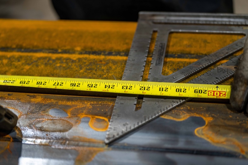 A speed square and tape measure