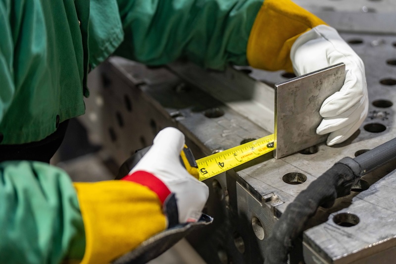 A man working on a stainless steel project
