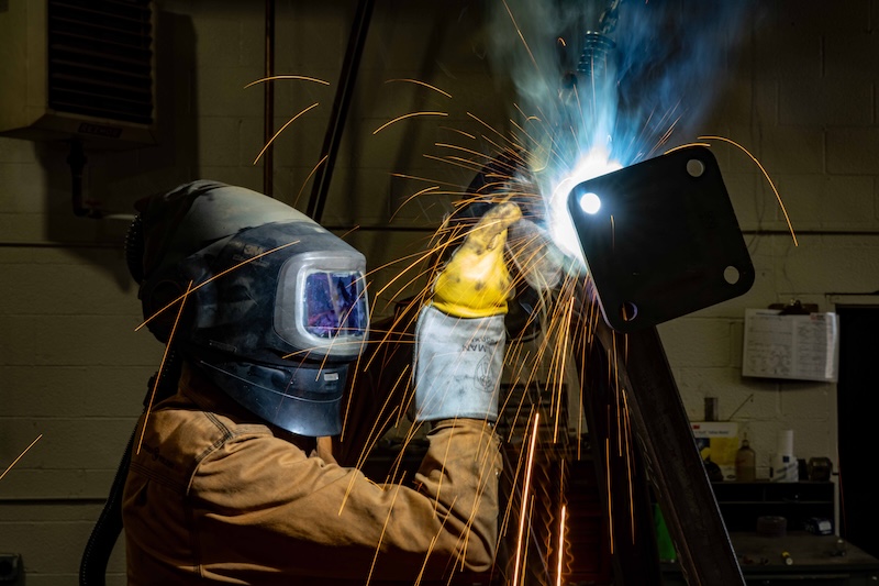 An up-close photo of a man welding