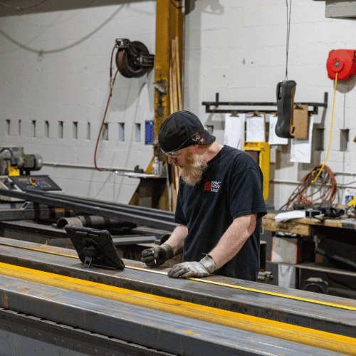 A metal fabrication employee in the shop