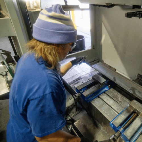 A metal fabrication employee in the shop
